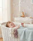 Stork And Baby white, beige, and mauve floral baby headbands with bows in a 5-pack set.