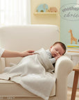 Stork And Baby grey cotton waffle blanket with cloud embroidery, perfect for newborns.