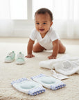 Stork And Baby Mothers Choice Inf Blue Kneeguards with padded blue inserts and blue checkered trim.