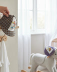 Stork And Baby brown plaid infant cap with embroidered cartoon character on white panel. Soft, lightweight, and stylish.