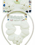 Stork And Baby Mothers Choice infant girls hair accessory set with white flower clips, headband, and scrunchie.