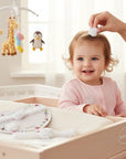 Stork And Baby infant hair accessory set featuring white polka dot strawberry designs on a smiling baby girl