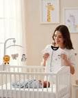 Stork And Baby white infant romper with black trim and sailor-themed embroidery. Soft cotton.