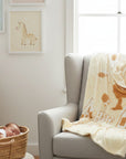 Stork And Baby beige and white polyester mink baby blanket with cutwork house and sun pattern. 110x140cm.