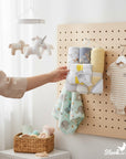 Stork And Baby 6-piece baby bath set with hooded towels and facecloths featuring a jungle cutie elephant print and yellow stripes.