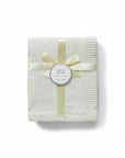Stork And Baby Mothers Choice 100% cotton beige baby shawl with a diamond knit pattern, tied with a satin ribbon.