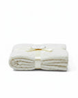 Stork And Baby Mothers Choice beige 100% cotton baby shawl with a soft diamond knit pattern and ribbon tie.