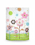 Stork And Baby Mothers Choice baby quilt featuring a white background with colorful floral and polka dot patterns.