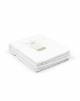 Stork And Baby Mothers Choice white 100% cotton receiving blanket folded neatly with a product tag on a white background