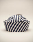 Stork And Baby navy and white striped dough boy hat for infants, soft cotton, classic sailor style.
