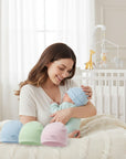 Stork And Baby pastel bonnets in blue, green, and pink, made of 100% cotton with round tops.