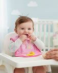 Stork And Baby pink bib with teether rings and "Teething Bites" embroidery, featuring an elephant detail on the sleeve.
