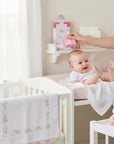 Stork And Baby 6 pack baby washcloths in pink floral pattern, soft and absorbent cotton for gentle cleaning.