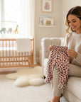 Stork And Baby pink leopard print 100% cotton footed baby leggings with a comfortable elastic waistband.