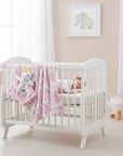 Stork And Baby pink floral baby blanket with attached unicorn plush toy. Perfect for nursery.
