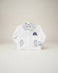 Stork And Baby white 100% cotton long sleeve baby jacket with circus tent embroidery and confetti print collar and cuffs.
