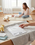 Stork And Baby white 100% cotton short sleeve infant vests, packaged and ready for use.
