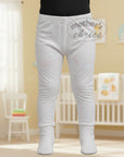 Stork And Baby white 100% cotton baby leggings with pink hearts, footed style.
