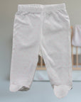 Stork And Baby white 100% cotton baby leggings with pink hearts print, footed design.
