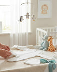 Stork And Baby white preemie grower and hat set made of soft cotton for newborns. Includes a footed sleeper and matching cap.