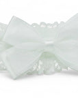 Stork And Baby white satin and lace girls alice band featuring a decorative polka dot bow for special occasions.