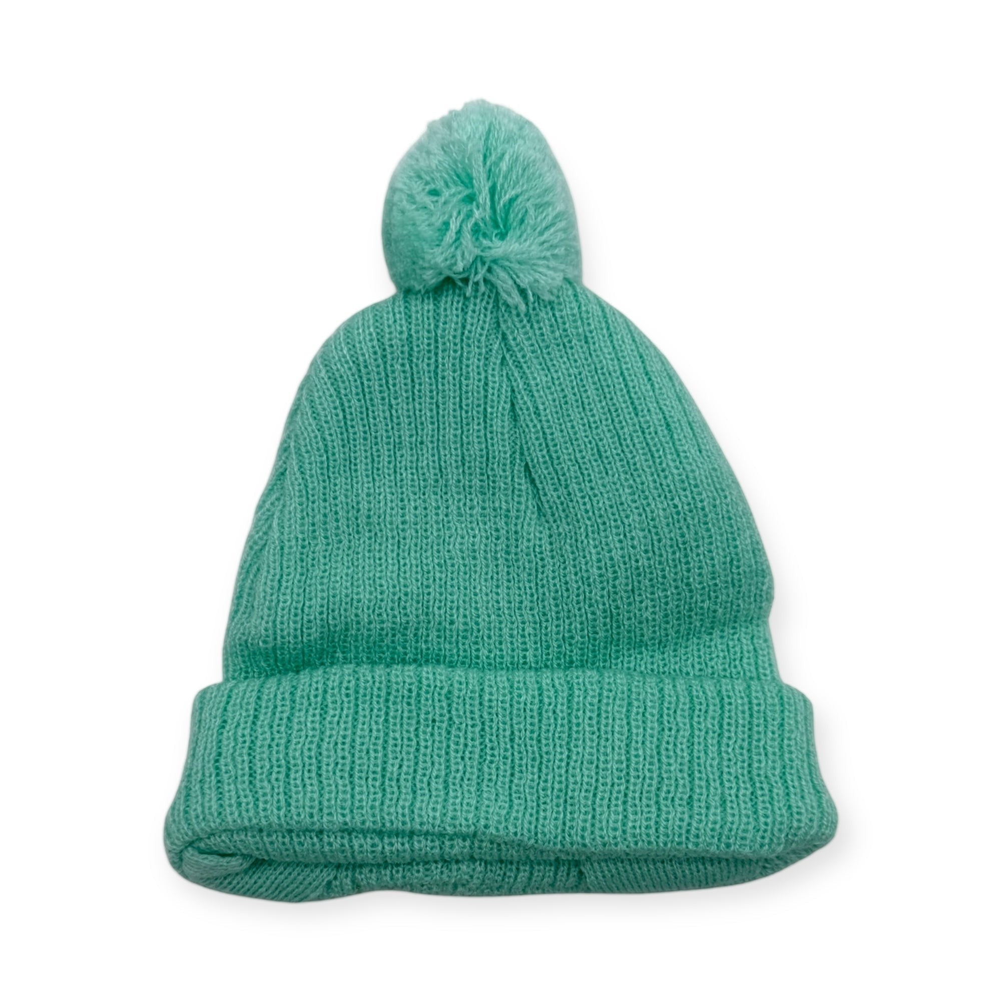 Green knit beanie with a pom-pom on a white background