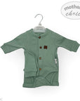 Green baby outfit on a hanger with 'Mother's Choice' branding.