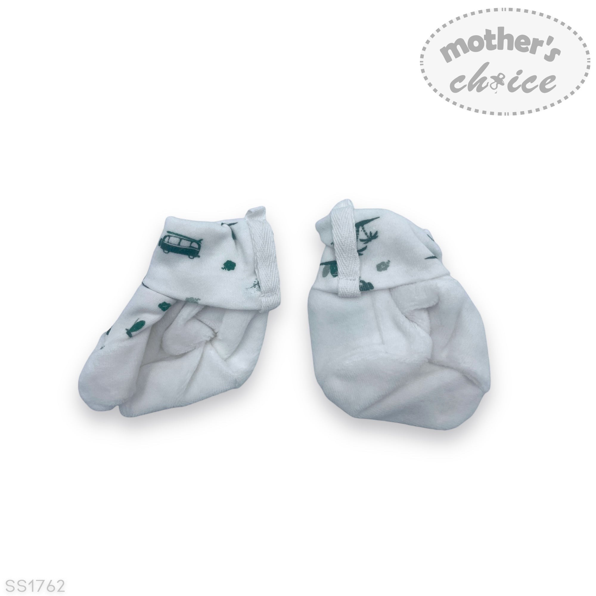 Pair of white baby socks with green patterns on a white background, branded 'Mother's Choice'.
