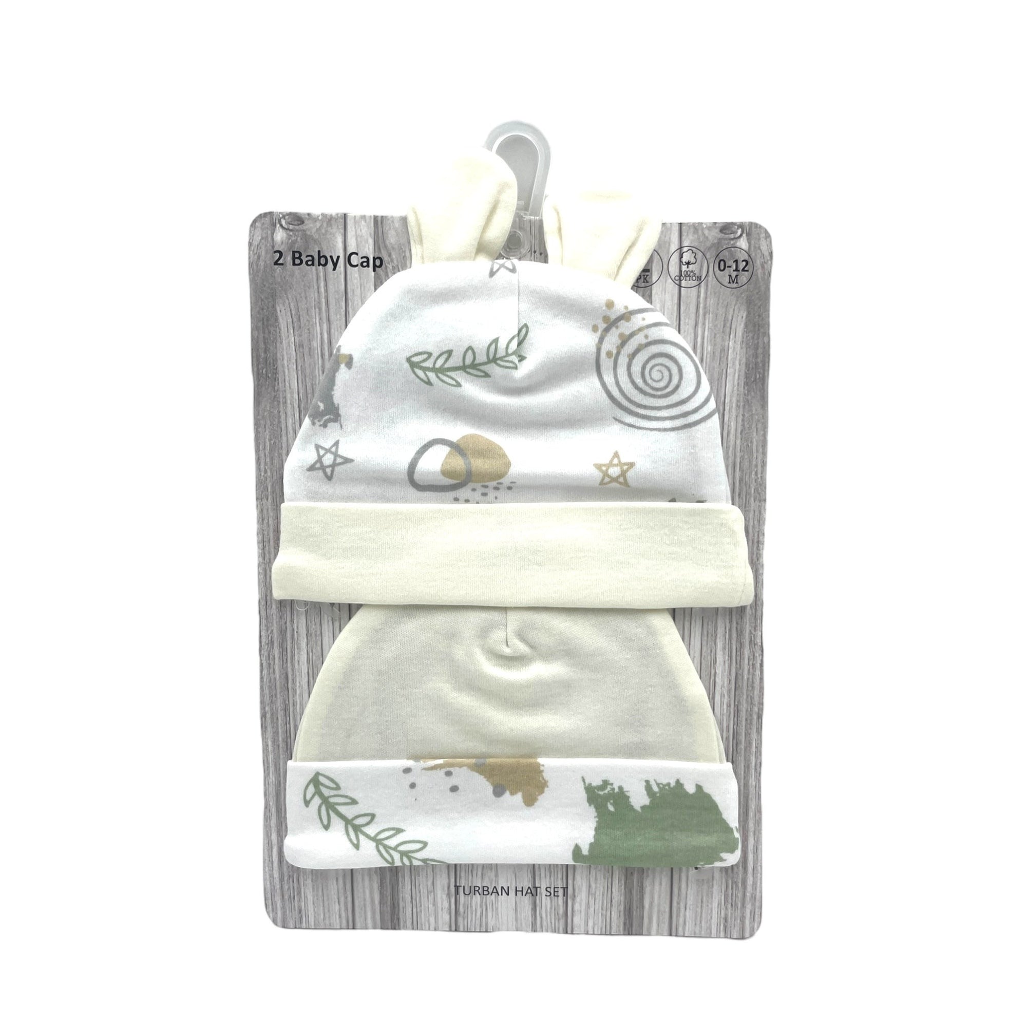 Set of two baby caps with patterns on a wooden-textured card packaging.