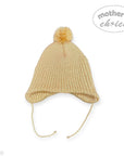 Beige knitted baby hat with a pom-pom on a white background, featuring 'Mother's Choice' branding.