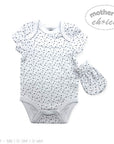 Baby bodysuit with black polka dots and matching hat on a white background, featuring 'Mother's Choice' branding.