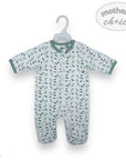 Baby onesie with floral pattern on a hanger against a white background