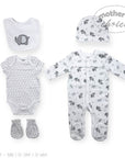 Baby clothing set with onesie, bib, hat, and booties featuring elephant patterns on a white background.