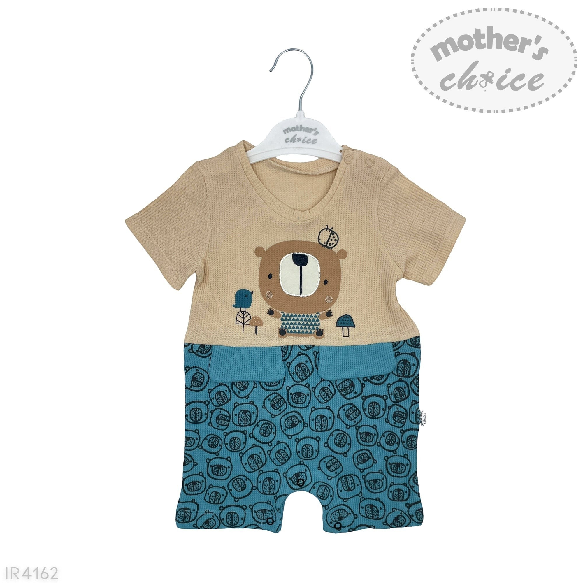Baby romper with bear design on a hanger against a white background