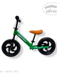 Green balance bike with brown seat on a white background, branded 'Mother's Choice'.