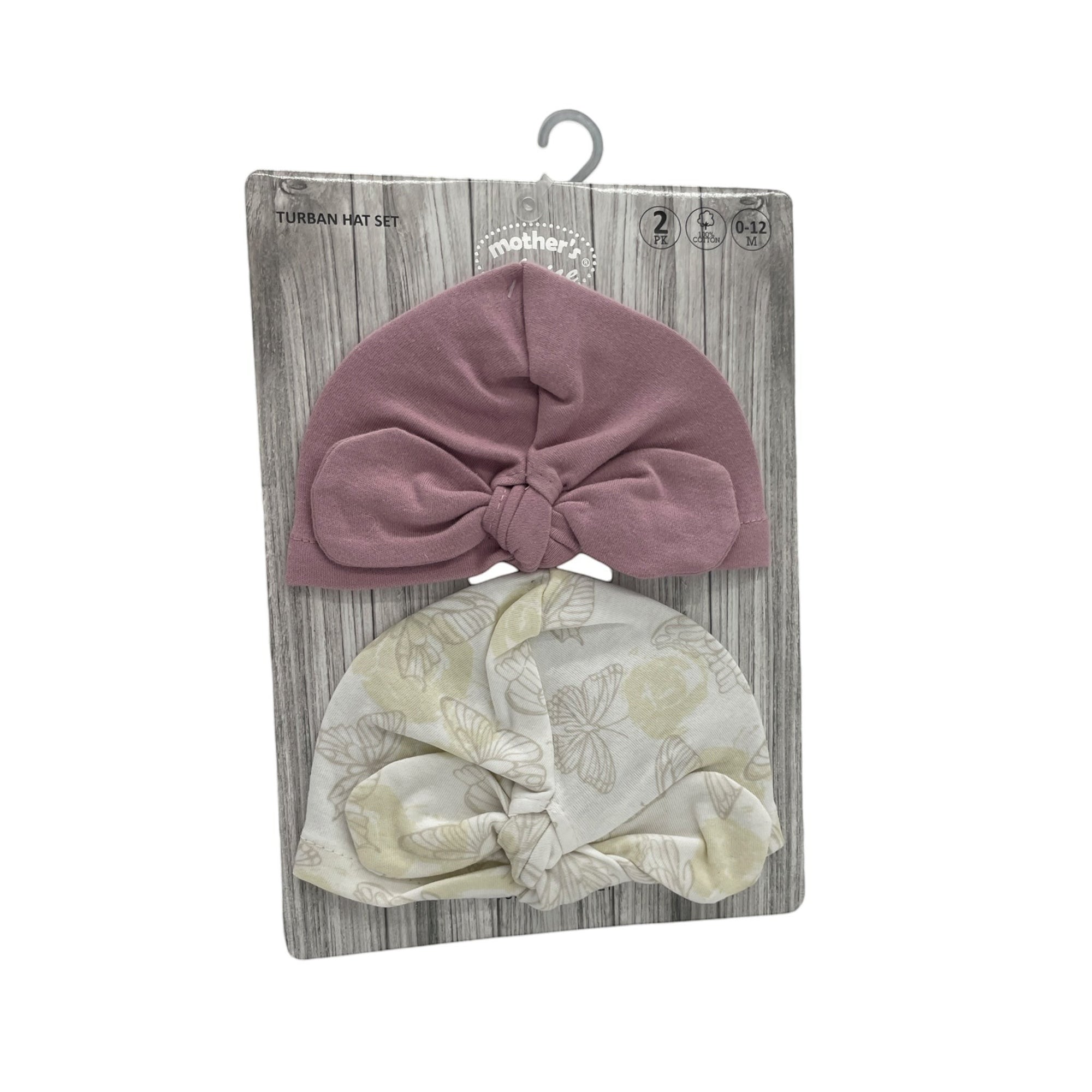 Two baby turban hats on a wooden display card with a hook.