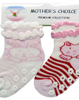 Two baby socks with cat designs on a 'Mother's Choice' branded card.
