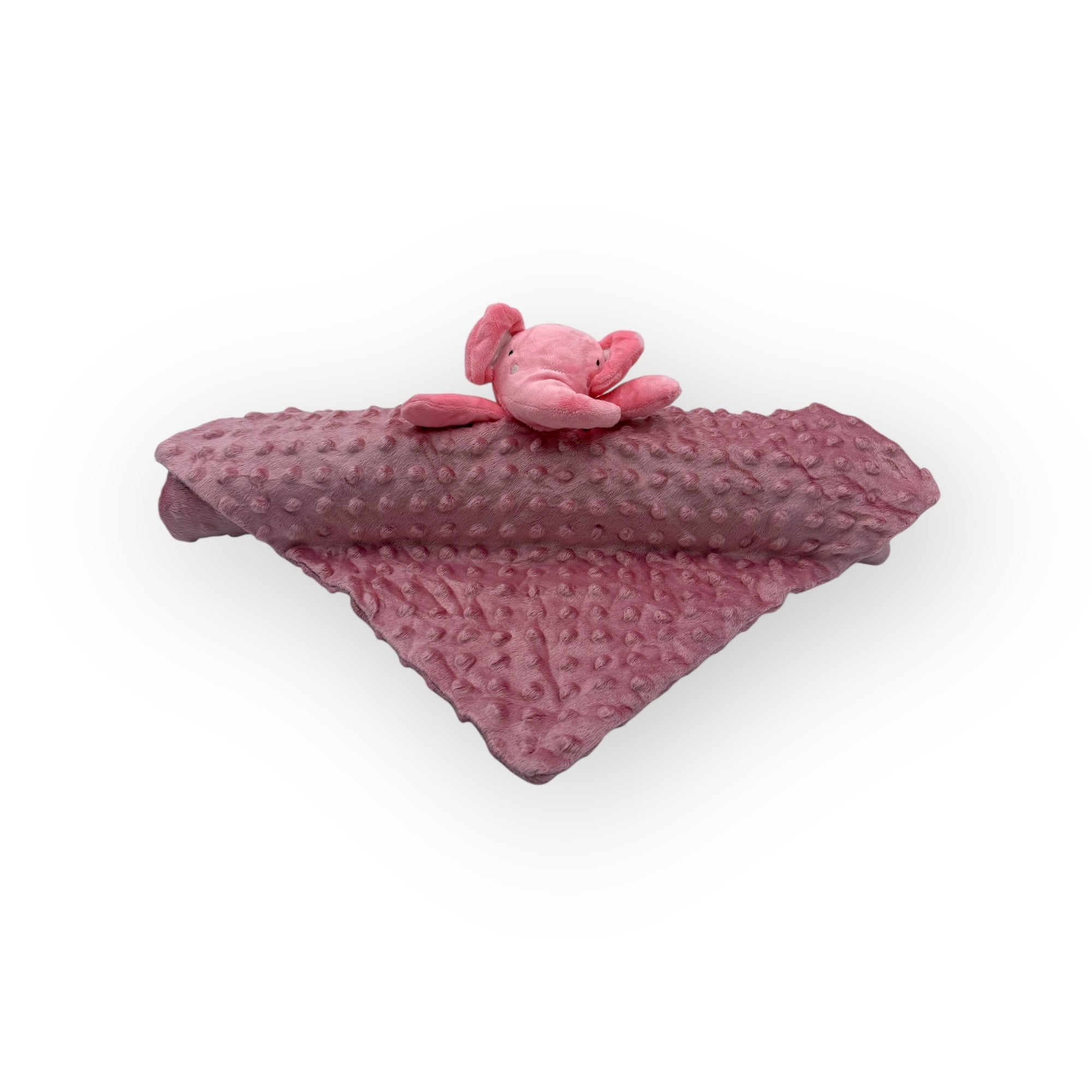 Pink textured blanket with a small pink plush toy on a white background