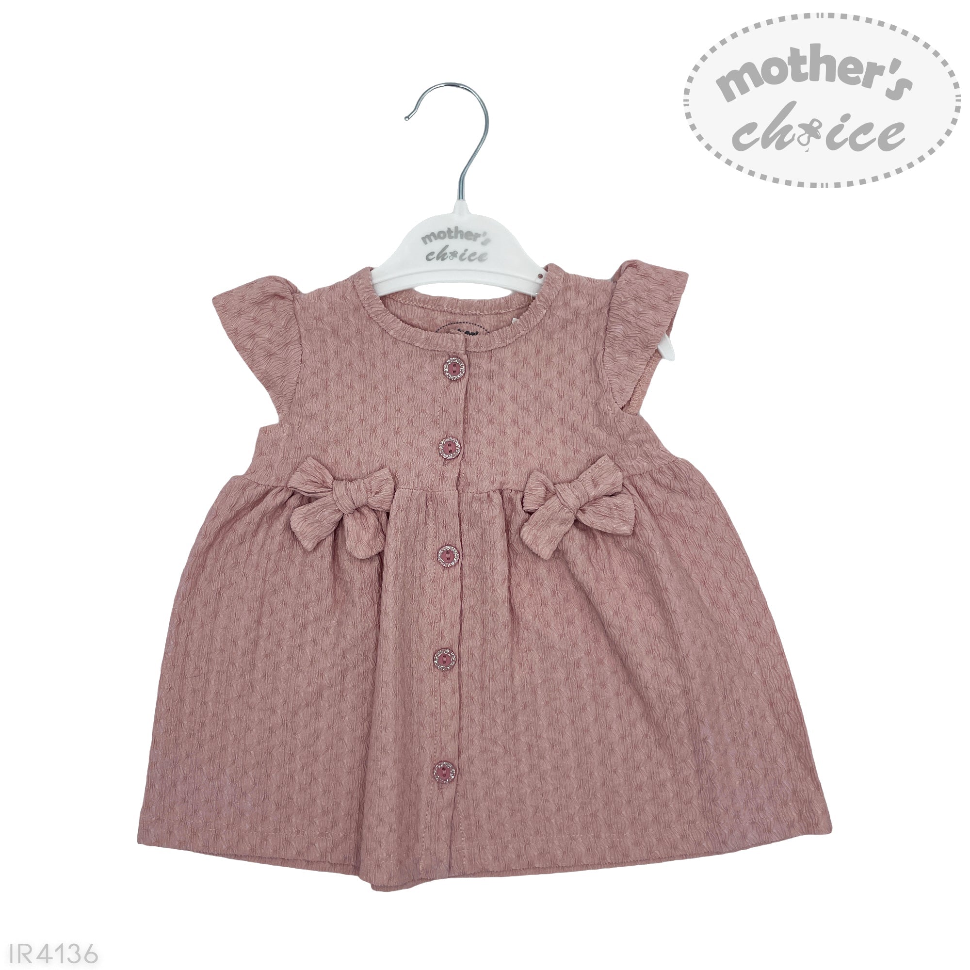 Pink baby dress with bows on a hanger against a white background