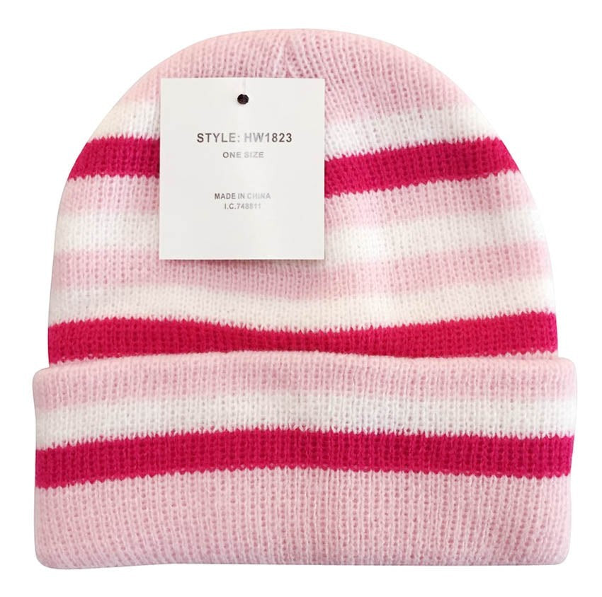 Pink and white striped beanie with a tag on a white background