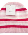 Pink and white striped beanie with a tag on a white background