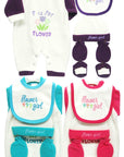 Set of baby clothing and accessories with 'flower girl' theme on a white background