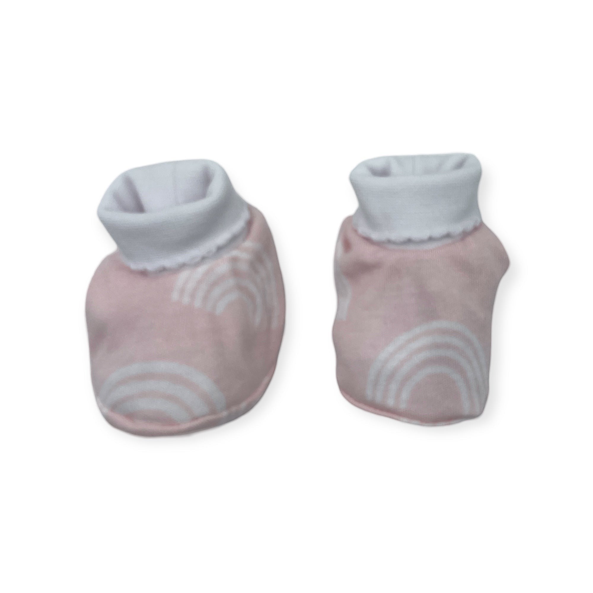 Pair of baby socks with gray cuffs and pink sole with white patterns on a white background