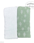 Two baby blankets, one white and one green with tree pattern, on a white background.