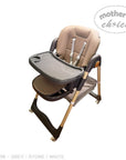 Beige and gray high chair with tray on a white background, branded 'Mother's Choice'.