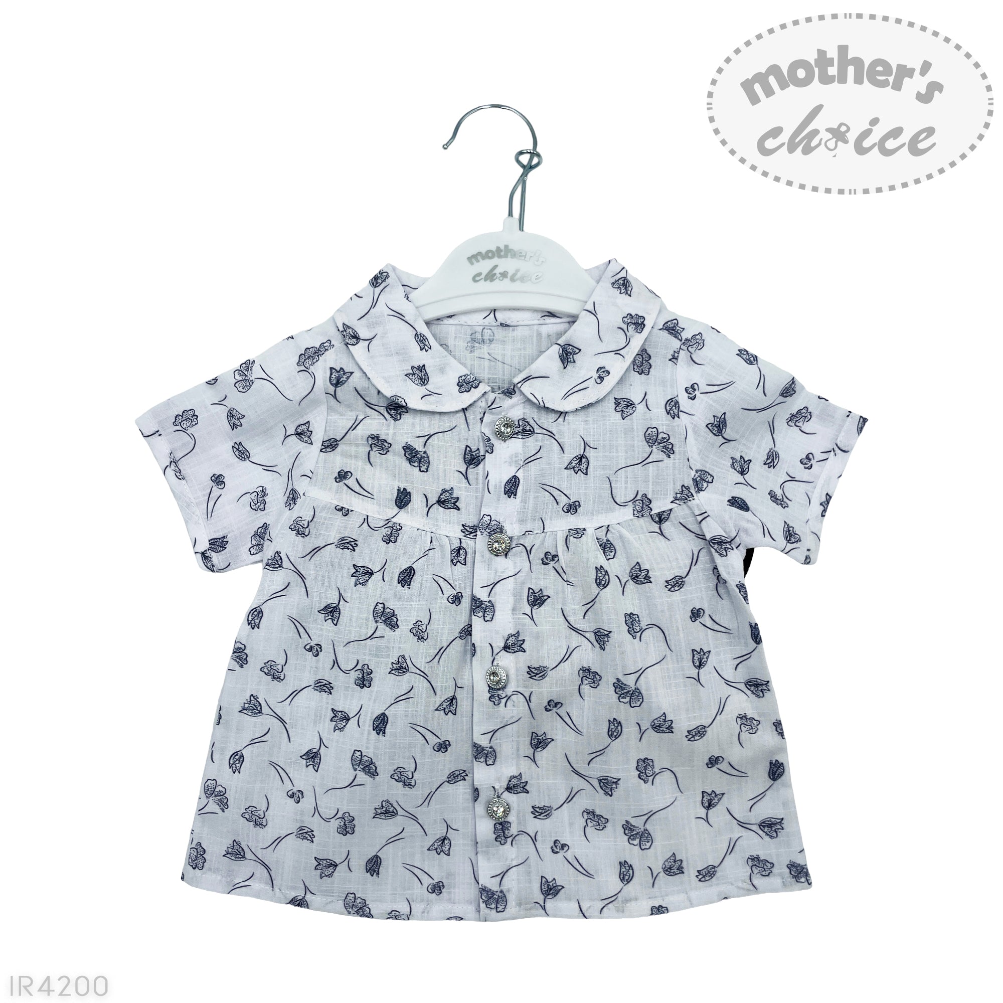 White shirt with black floral pattern on a hanger with 'mother's choice' label.