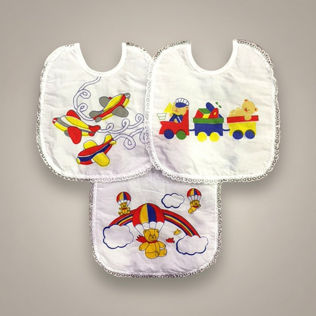 Three baby bibs with colorful airplane, train, and bear designs on a gray background