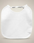 White baby bib on a beige background