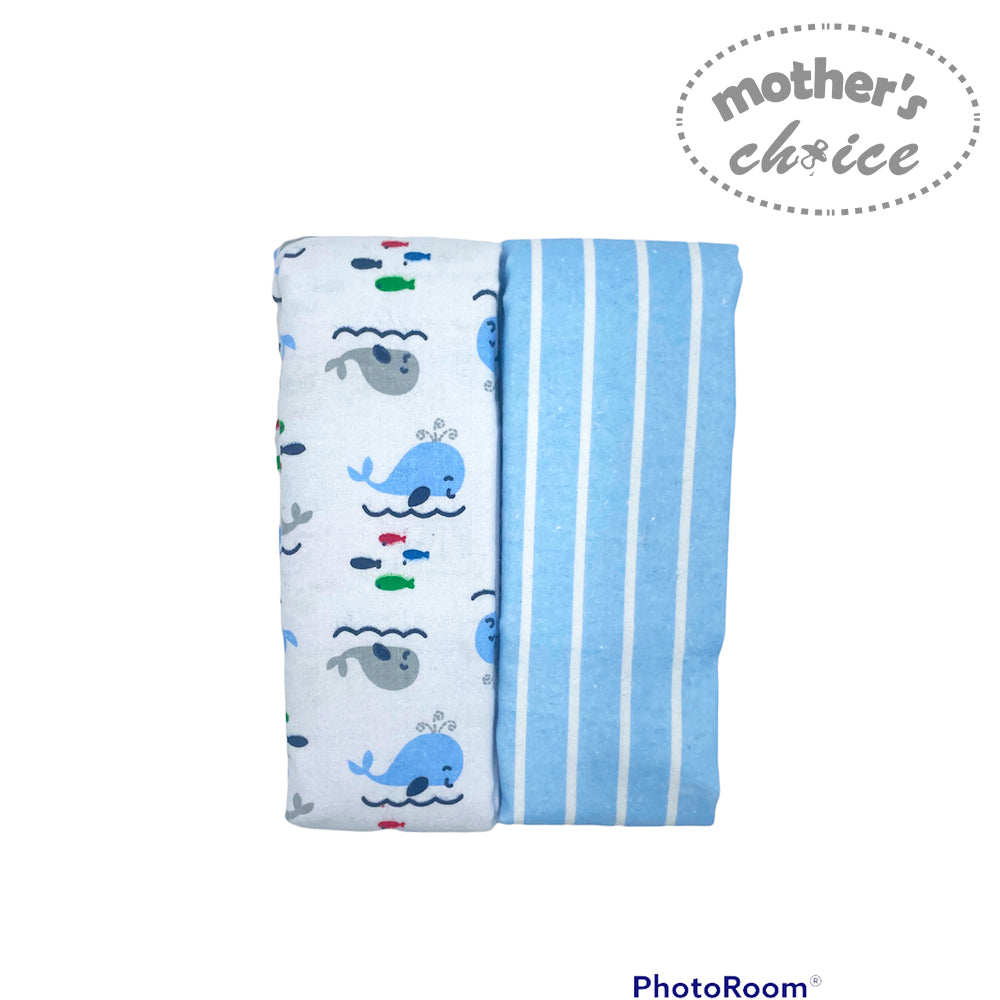 Folded baby blanket with whale pattern and blue stripes on a white background, branded 'Mother's Choice'.
