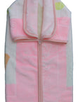 Folded pink baby blanket with cartoon designs on a white background